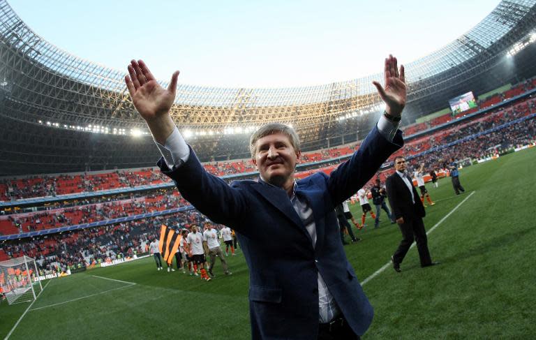 FC Shakhtar Donetsk President Rinat Akhmetov greets fans in Donetsk on April 28, 2013, after the team played a draw against FC Metalist Kharkiv