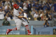 St. Louis Cardinals designated hitter Albert Pujols (5) hits a home run during the fourth inning of a baseball game against the Los Angeles Dodgers in Los Angeles, Friday, Sept. 23, 2022. Brendan Donovan and Tommy Edman also scored. It was Pujols' 700th career home run. (AP Photo/Ashley Landis)