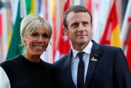 FILE PHOTO - French President Emmanuel Macron and hiw wife Brigitte Macron are seen July 7, 2017 at the G20 summit in Hamburg, Germany. Picture taken July 7, 2017. REUTERS/Wolfgang Rattay/File Photo