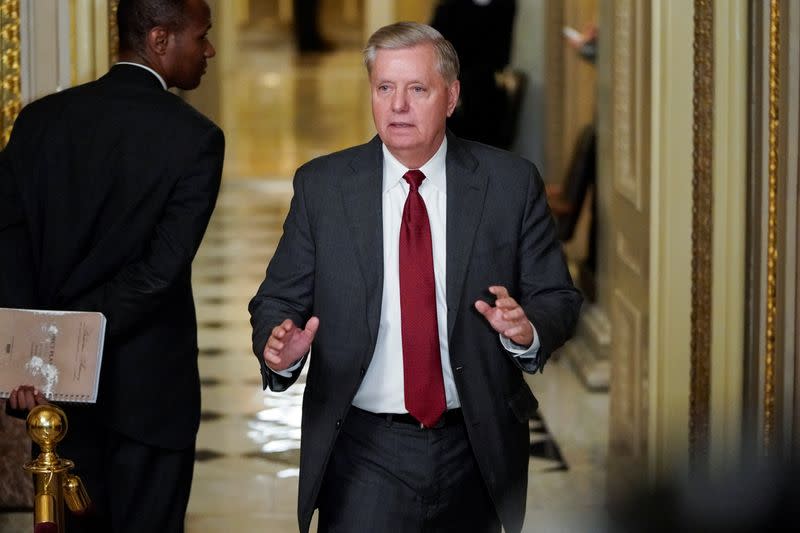 Senator Graham walks to the Senate Chamber as the Trump impeachment trial continues in Washington.