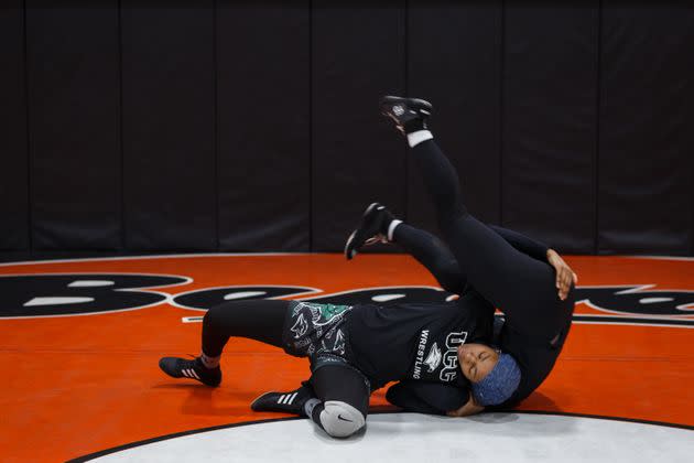 Ibrahim works out with teammate Avery Shinkle during afternoon wrestling practice, April 16. 