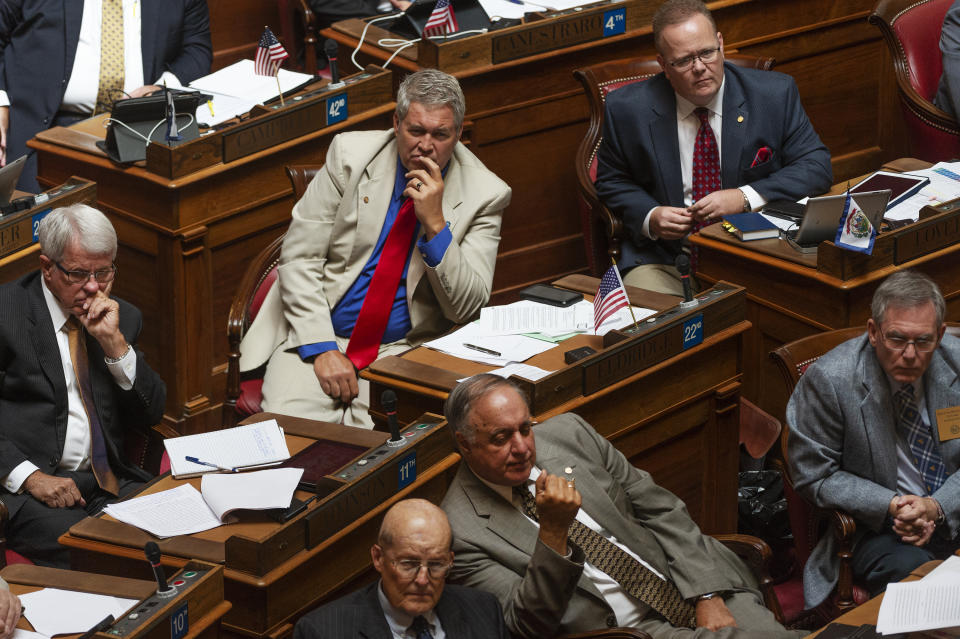 Delegates listen to a speaker during a special session of the state House of Delegates in Charleston, W.V., on Monday, Aug. 13, 2018. The delegates are voting on 15 articles of impeachment charges against Supreme Court Chief Justice Margaret Workman and Justices Robin Davis, Allen Loughry and Beth Walker. (Craig Hudson/Charleston Gazette-Mail via AP)