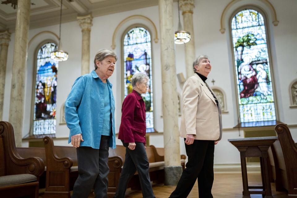 Sisters Donna Dodge, left, Margaret Egan, center, and Margaret M. O'Brien, right, members of the leadership council of the Sisters of Charity, walk into the Chapel of the Immaculate Conception where they took their vows at various times, after an interview at the College of Mount Saint Vincent, a private Catholic college in the Bronx borough of New York, on Tuesday, May 2, 2023. In more than 200 years of service, the Sisters of Charity of New York have cared for orphans, taught children, nursed the Civil War wounded and joined Civil Rights demonstrations. Last week, the Catholic nuns decided that it will no longer accept new members in the United States and will accept the "path of completion." (AP Photo/John Minchillo)