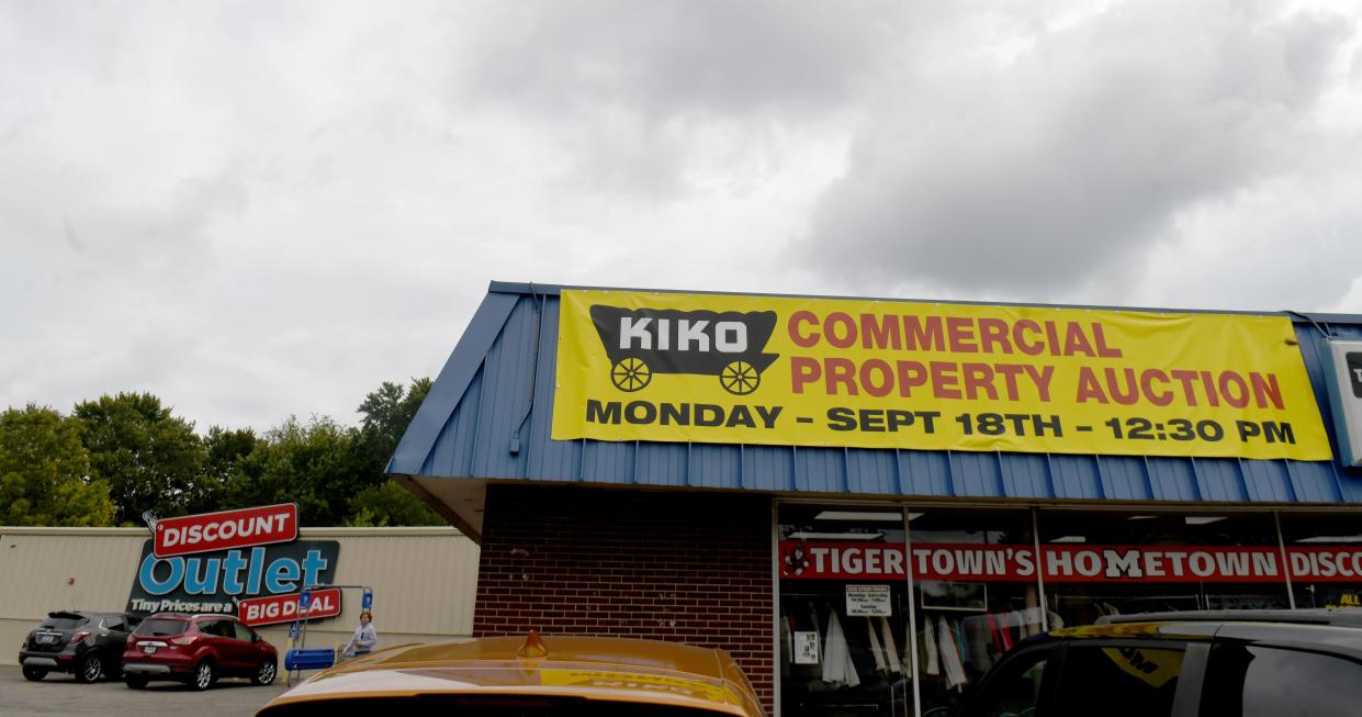 The Discount Outlet building, 1070 First St. NE in Massillon, and adjacent properties sold Monday afternoon via auction. The business is slated to remain open until mid-October.