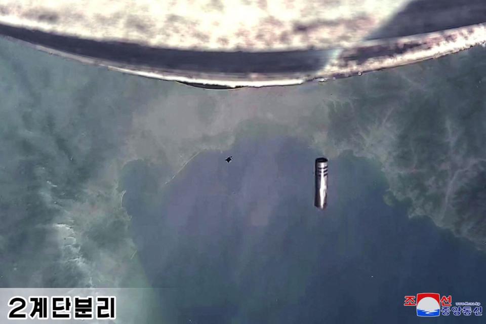 North Korea’s new solid-fuel intercontinental ballistic missile during second stage separation scene taken by a camera mounted on the new Hwasong-18 intercontinental ballistic missile (ICBM) (KCNA VIA KNS/AFP via Getty Image)