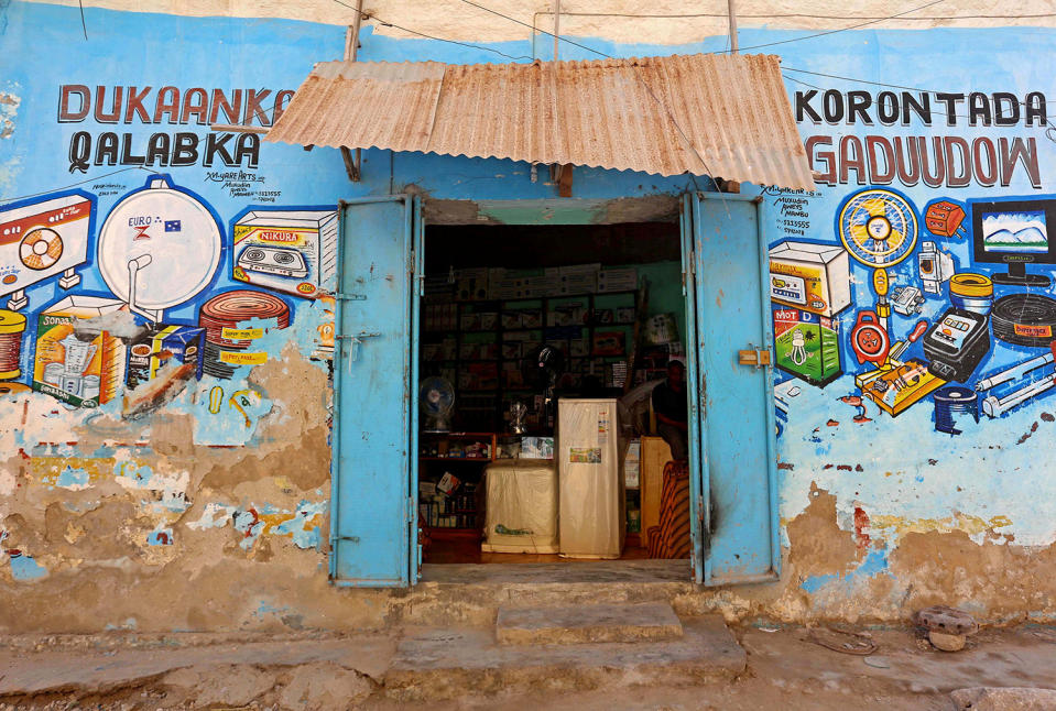 <p>A mural illustrating electronic appliances is seen on a wall of a shop in Hamarweyne district of Mogadishu, Somalia, June 8, 2017. (Photo: Feisal Omar/Reuters) </p>