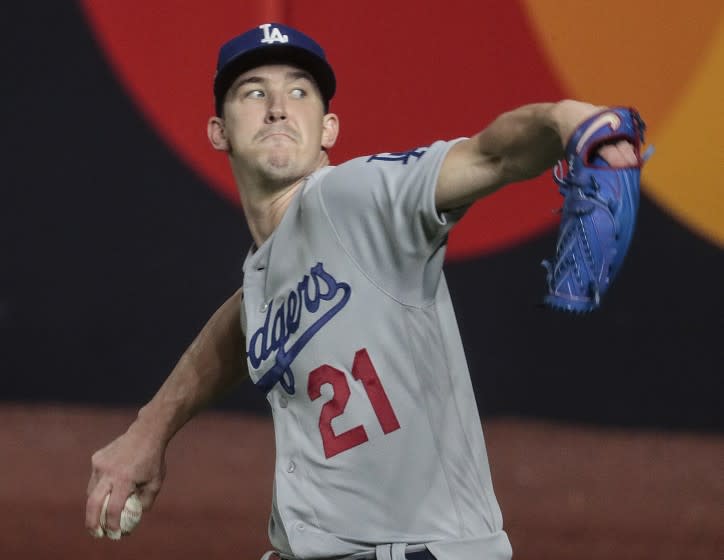 Arlington, Texas, Friday, October 23, 2020 Los Angeles Dodgers starting pitcher Walker Buehler (21) warms up.