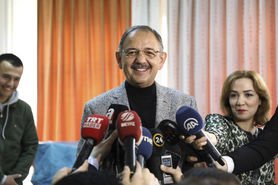 Mehmet Ozhaseki, the mayoral candidate for Ankara of Turkey's ruling Justice and Development Party, AKP and Nationalist Movement Party, MHP, talks to the media as his casts his ballot, in Ankara, Turkey, Sunday, March 31, 2019. Turkish citizens have begun casting votes in municipal elections for mayors, local assembly representatives and neighborhood or village administrators that are seen as a barometer of Erdogan's popularity amid a sharp economic downturn. (AP Photo/Ali Unal)