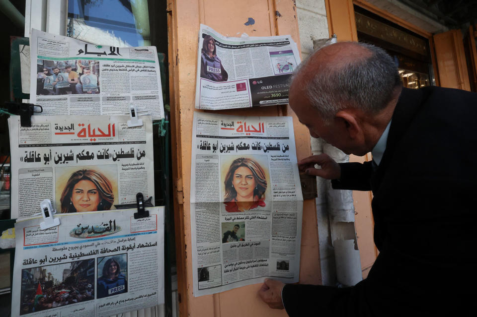 A Palestinian man looks at the front pages of local newspapers reporting on the death of veteran Al Jazeera journalist Shireen Abu Akleh, who was shot dead while covering an Israeli army raid in Jenin, West Bank, on May 12, 2022.<span class="copyright">Hazem Bader—AFP/Getty Images</span>