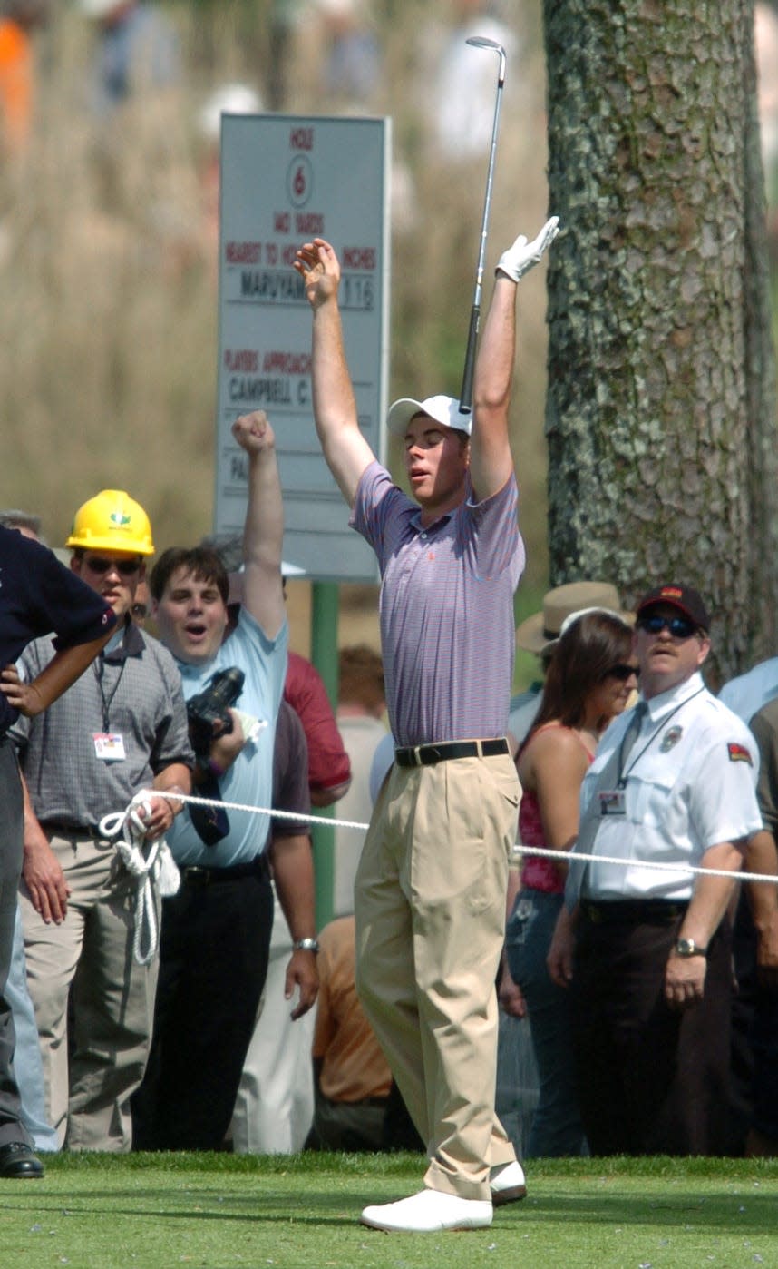 Luke List celebrates with the gallery after hitting a hole in one on the seventh hole on the Par 3 course at the Augusta National in 2005.