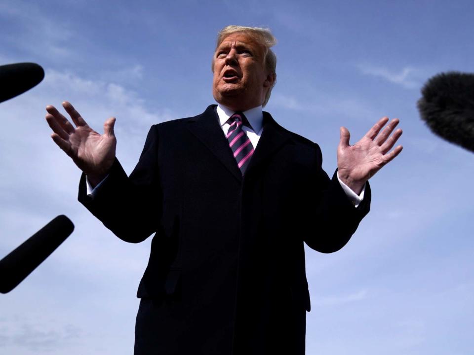 Donald Trump talks to the media at Andrews Air Force Base in Maryland while on his way to a fundraiser in California: AP