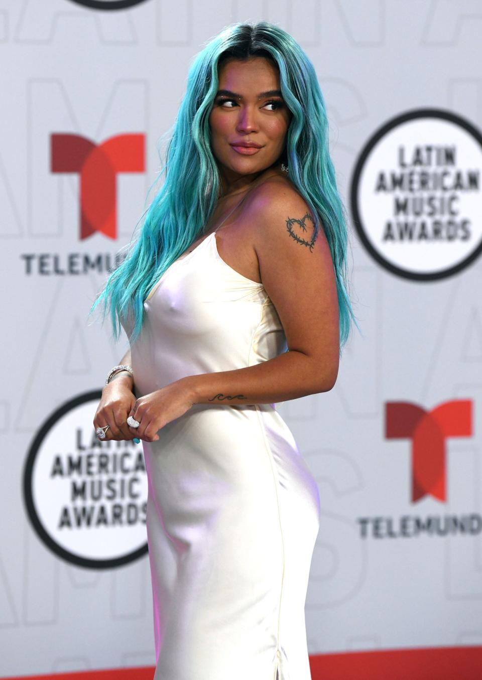 Karol G arrives at the Latin American Music Awards at the BB&T Center on Thursday, April 15, 2021, in Sunrise, Fla. (AP Photo/Taimy Alvarez)