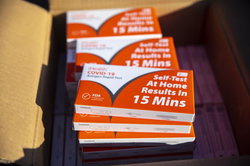 Redondo Beach, CA - January 06: Boxes of iHealth COVID-19 Antigen Rapid Test kits, provided by the state of California, are ready for parents to pick up, at Tulita Elementary School, as positive COVID-19 cases spike with the spread of the Omicron strain, in Redondo Beach, CA, Thursday, Jan. 6, 2022. (Jay L. Clendenin / Los Angeles Times)