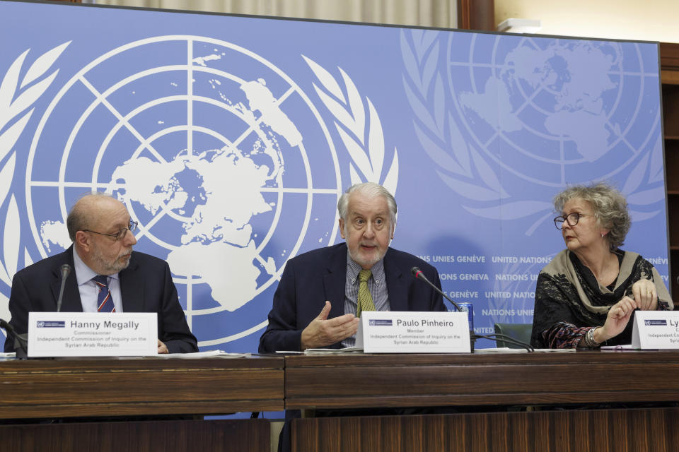 Brazilian Paulo Pinheiro, centre, Chairperson of the Commission of Inquiry on Syria, sitting between commission members Hanny Megally of Egypt, left, and Lynn Welchman of Britian, right, talks to the media during a press conference before presenting the last report by the commission on the human rights situation in Syria at the 52nd session of the Human Rights Council, at the European headquarters of the United Nations in Geneva, Switzerland, Monday, March 13, 2023. (Salvatore Di Nolfi/Keystone via AP)