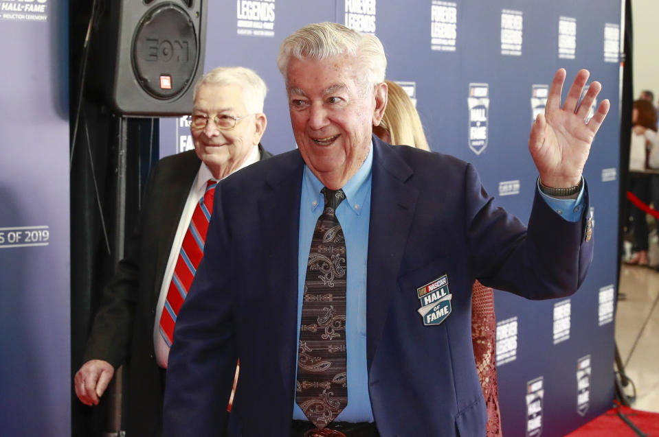 Former NASCAR driver and hall of famer Bobby Allison waves as he arrives on the red carpet before the NASCAR Hall of Fame induction ceremony for the class of 2019, Friday, Feb. 1, 2019, in Charlotte, N.C. (AP Photo/Jason E. Miczek)