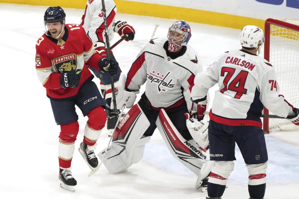 Florida Panthers center Sam Reinhart (13) celebrates a goal against Washington Capitals goaltender Darcy Kuemper (35) during the second period of an NHL hockey game Thursday, Feb. 8, 2024, in Sunrise, Fla. (AP Photo/Jim Rassol)