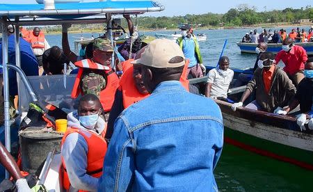 Rescuers search to retrieve bodies from the water after a ferry overturned off the shores of Ukerewe Island on Lake Victoria, Tanzania September 21, 2018. REUTERS/Stringer