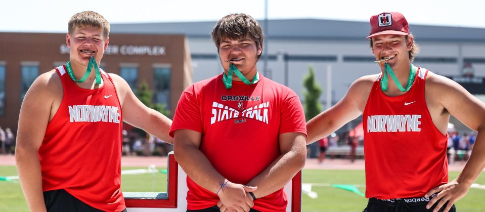 (L-R) Norwayne's Brandt Morlock and Dillon Morlock, and Orrville's Talon Beichler (center) took a bite out of State earning three All-Ohio places in shot put in Div. II capped by Dillon earning the state title.