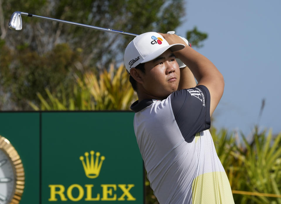 Tom Kim, of South Korea, watches his shot on the second tee during the second round of the Hero World Challenge PGA Tour at the Albany Golf Club in New Providence, Bahamas, Friday, Dec. 2, 2022. (AP Photo/Fernando Llano)