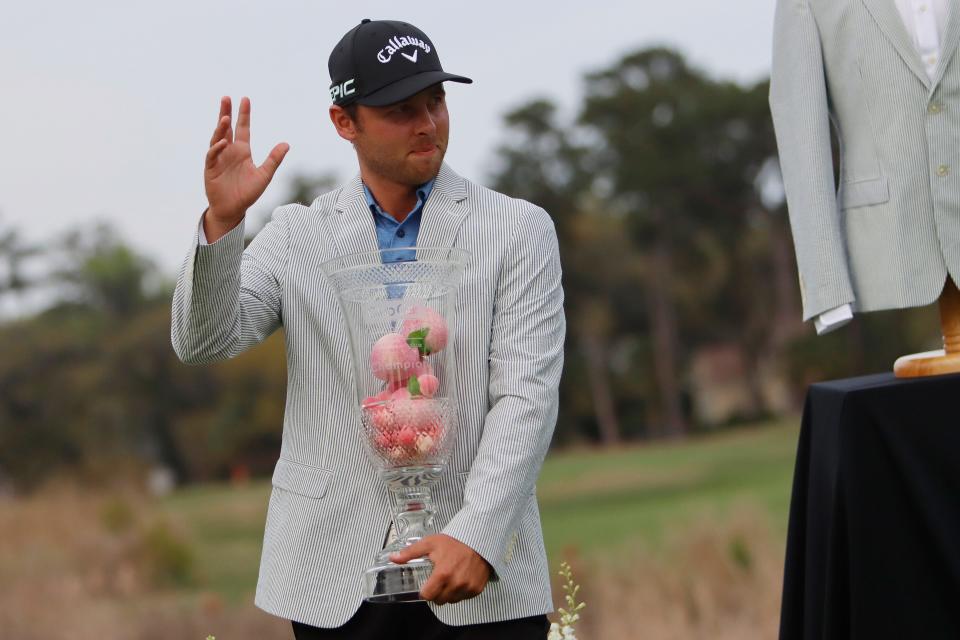 Adam Svensson holds his trophy after after winning the Club Car Championship at The Landings Club's Deer Creek Course in Savannah on Sunday, March 28, 2021.