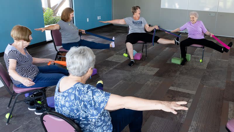 Pam Sadler, Sharron Lovato, volunteer instructor Daline Rostron, Suzanne Butterworth and Joyce Jackson, clockwise from front left, stretch during a yoga class at the Midvale Senior Center in Midvale on Friday, June 30, 2023. Yoga, one activity offered at the center, helps retirees stay limber and sharp.