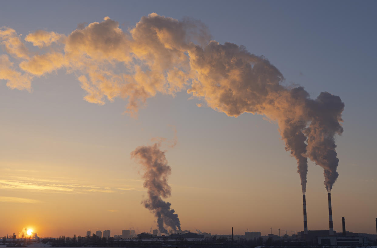 Environmental pollution. Global warming. Climate change. Dirty energy. Factory chimneys emit harmful substances into air