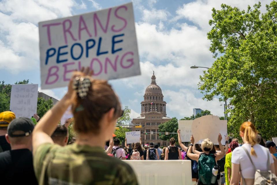 People march to the Texas State Capitol during a Queer March demonstration on April 15, 2023 in Austin, Texas.
