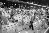 FILE — Fans attempt to take apart Yankee Stadium in New York City, on the last day of the season, Sept. 30,1973. It was the last day of the old stadium, in use since 1923. The 100th anniversary of the original Yankee Stadium is marked Tuesday, April 18, 2023, a ballpark that revolutionized baseball with its grandeur and the success of the team. (AP Photo/Richard Drew, File)