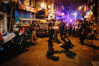 <p>Filipino police investigators examine a crime scene after an alleged drug user was shot dead by unidentified men in Manila, Philippines, Sept. 24, 2016. (Photo: MARK R. CRISTINO/EPA)</p>