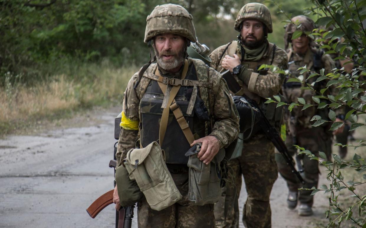 Ukrainian servicemen go to a position in the city of Severodonetsk of Luhansk area - OLEKSANDR RATUSHNIAK/EPA-EFE/Shutterstock