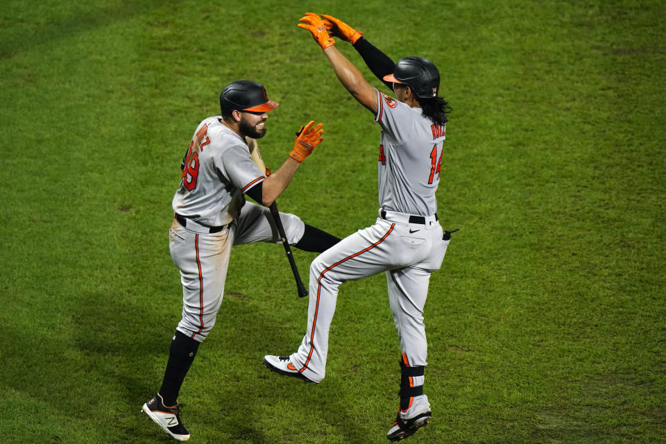 Baltimore Orioles' Rio Ruiz, right, and Renato Nunez celebrate after Ruiz's home run off Philadelphia Phillies pitcher Zach Eflin during the fifth inning of a baseball game, Wednesday, Aug. 12, 2020, in Philadelphia. (AP Photo/Matt Slocum)