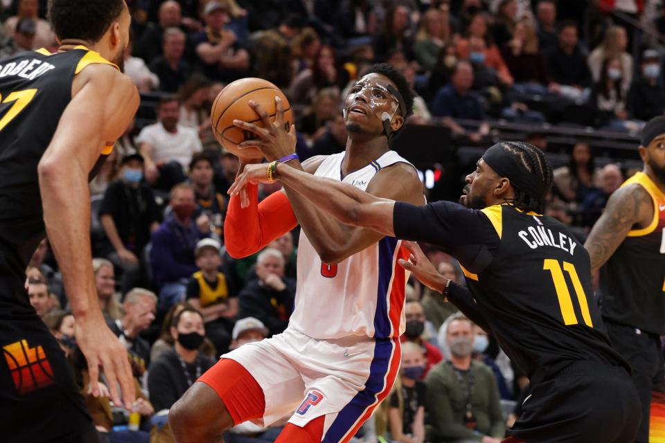 Utah Jazz guard Mike Conley (11) tries to keep Detroit Pistons guard Hamidou Diallo (6) from getting to the basket during the first quarter at Vivint Arena on Jan. 21, 2022.