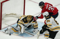 Washington Capitals right wing Anthony Mantha (39) cannot get the puck past Boston Bruins goaltender Tuukka Rask (40) with Bruins defenseman Kevan Miller (86) nearby during the third period of Game 2 of an NHL hockey Stanley Cup first-round playoff series Monday, May 17, 2021, in Washington. (AP Photo/Alex Brandon)