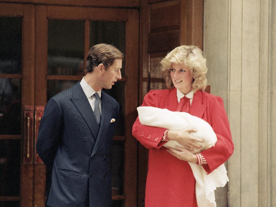 Prince Charles and Princess Diana leave the hospital with Prince Harry shortly after his birth in 1984.