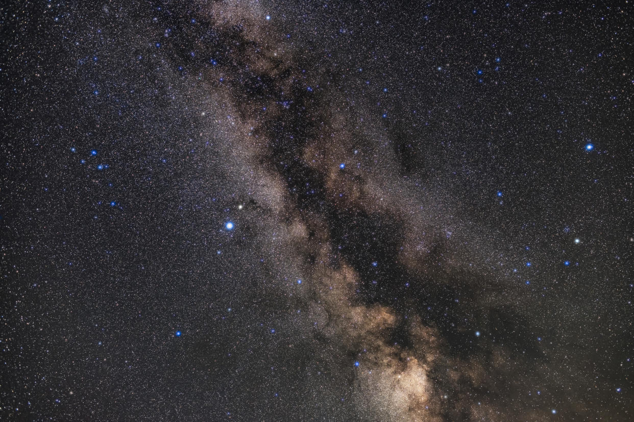 The constellation of Aquila (at centre) surrounded by Scutum and its starcloud (below) and Serpens and Ophiuchus (at right to the west). Altair is the bright star left of centre, with Tarazed above it. Albireo in Cygnus is at the very top Above Aquila and below Albireo are the small constellations of Sagitta, Vulpecula and Delphinus (the latter at left). The Coathanger asterism is visible at top in the Milky Way, as are the large open clusters IC 4756 and NGC 6633, the S-O Double Cluster, at right straddling the Serpens-Ophiuchus border.