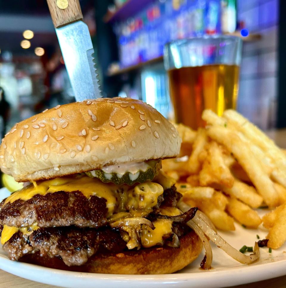 The Bibiana Burger at Saint Bibiana on Brady Street comes with two beef patties, American cheese, grilled onions, pickles and special sauce on a sesame seed bun.