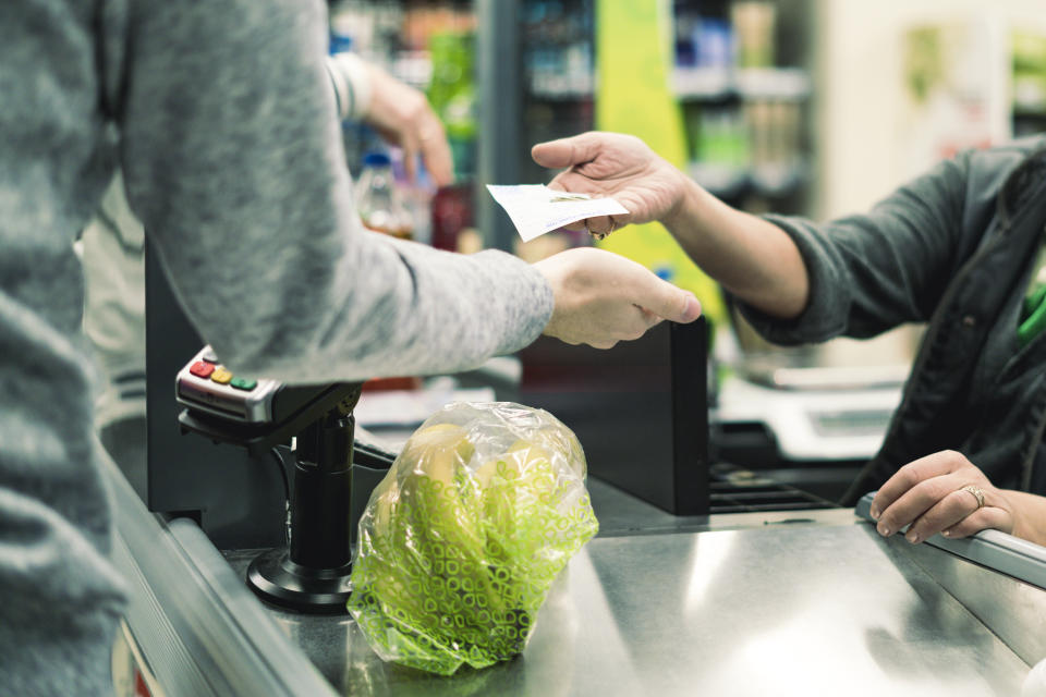 abstract consumer in the food store cashbox