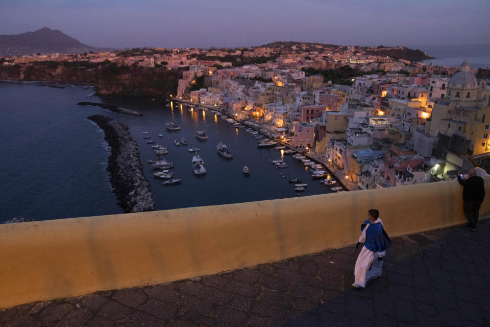 A participant in the Friday procession arrives at the Terra Murata old city in Procida Island, Italy, early Friday, March 29, 2024. Italy is known for the religious processions that take over towns big and small when Catholic feast days are celebrated throughout the year. But even in a country where public displays of popular piety are a centuries-old tradition, Procida's Holy Week commemorations stand out. (AP Photo/Alessandra Tarantino)