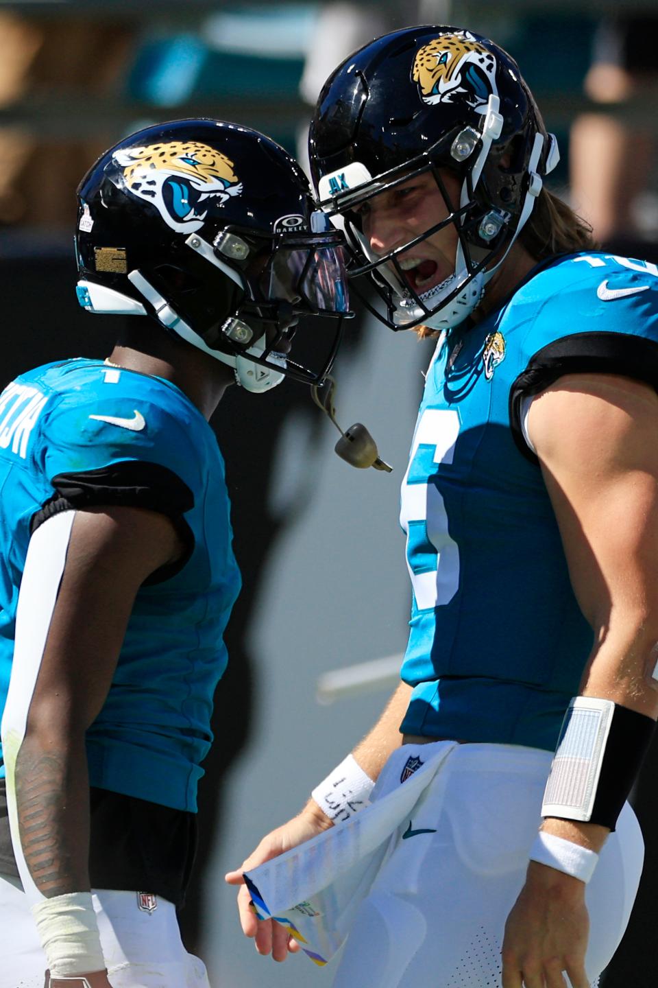 Jacksonville Jaguars quarterback Trevor Lawrence (16) celebrates a touchdown scored by running back Travis Etienne Jr. (1) during the second quarter of an NFL football matchup Sunday, Oct. 15, 2023 at EverBank Stadium in Jacksonville, Fla. The Jacksonville Jaguars defeated the Indianapolis Colts 37-20. [Corey Perrine/Florida Times-Union]