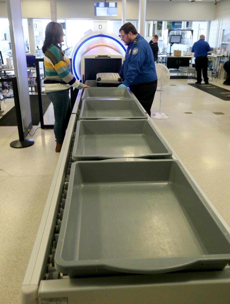 TSA agents do security checks for passengers at South Bend International Airport on Jan. 27, 2023.