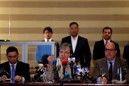 Colombian Foreign Minister Carlos Holmes Trujillo speaks next to Venezuelan opposition leader Juan Guaido's representative, Julio Borges and Guaido's designated U.S. Ambassador, Carlos Vechio, during a news conference in Bogota, Colombia April 27, 2019. REUTERS/Luisa Gonzalez