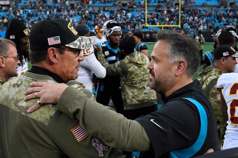 Could former Carolina coach Ron Rivera (left), now of the Commanders, and current Panthers boss Matt Rhule be fighting for their jobs in 2022?