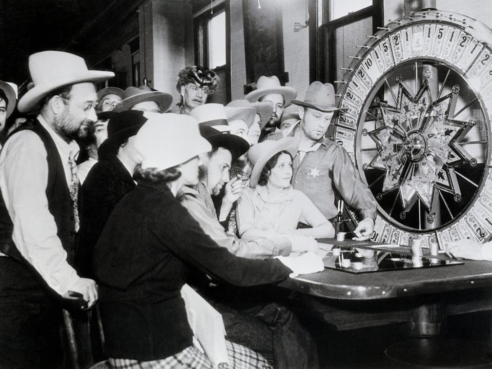 Gamblers watch the wheel of fortune spin in 1935.