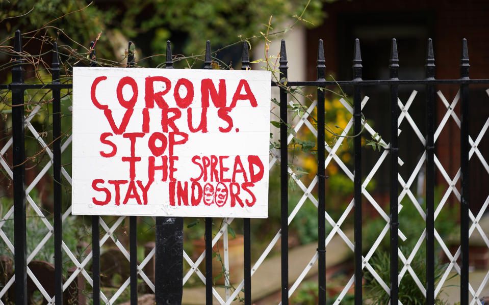 A sign in Holland Park, London, urging people to stay indoors, as the UK continues in lockdown to help curb the spread of the coronavirus. (Photo by John Walton/PA Images via Getty Images)