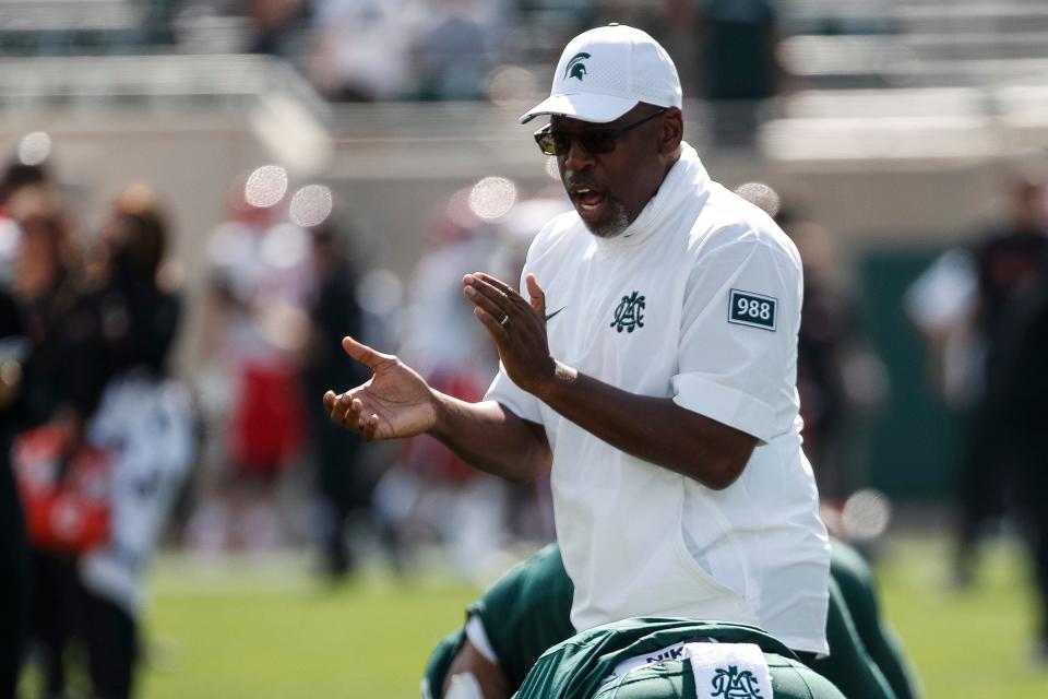 Michigan State acting head coach Harlon Barnett cheers for players before the Maryland game at Spartan Stadium in East Lansing on Saturday, Sept. 23, 2023.