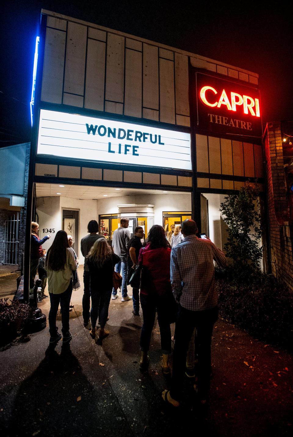 Guests arrive for a sold out showing of 'It's a Wonderful Life' at the Capri Theatre in Montgomery, Ala., on Saturday evening December 11, 2021.