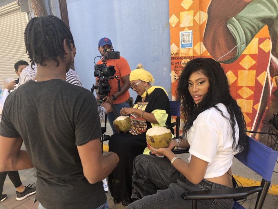 Noel Walker on set with Marcia Griffiths