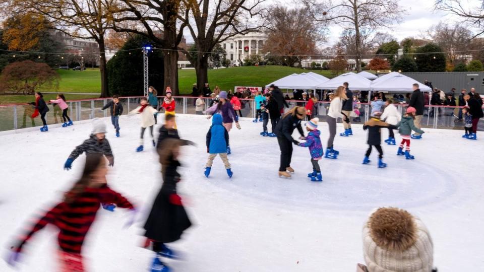 Guests skate on the White House ice rink on the South Lawn, Dec. 6. (Andrew Harnik/The Associated Press)