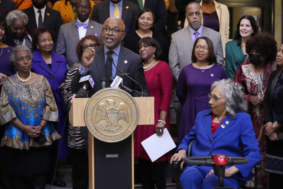 Former Mississippi State Rep. Alyce Clarke, D-Jackson, right, listens to comments made by State Rep. Robert Johnson, D-Natchez, at the ceremony where Clarke's official portrait was unveiled at the Mississippi State Capitol, Tuesday, Feb. 13, 2024, in Jackson. Clarke, a long-time legislator, is the first woman and the first African American to have a portrait hanging in the state Capitol. (AP Photo/Rogelio V. Solis)