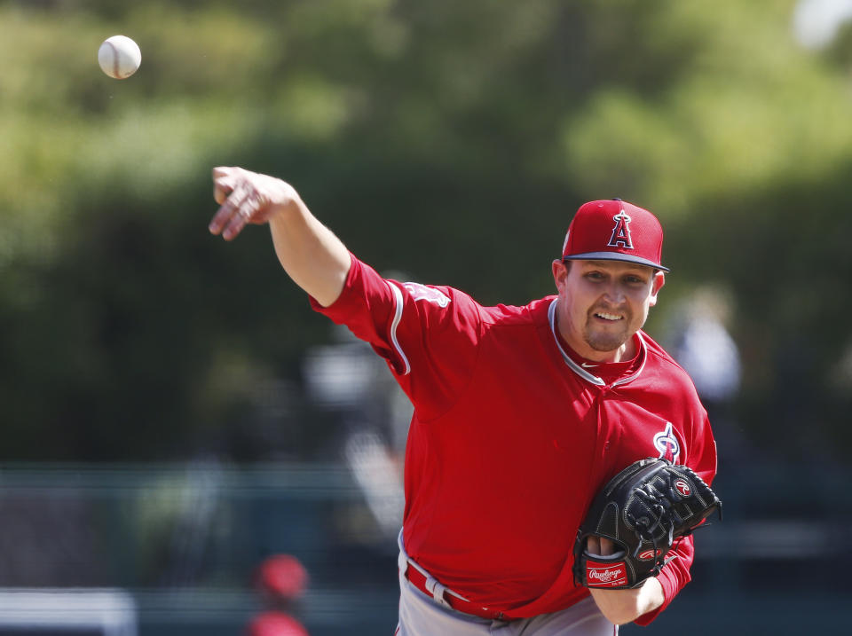 Los Angeles Angeles starting pitcher Trevor Cahill pitches in the first inning of a spring training baseball game against the Chicago White Sox Monday, March 4, 2019, in Glendale, Arizona. (AP Photo/Sue Ogrocki)